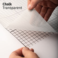 Load image into Gallery viewer, Chalk Transparent adhesive textile film with grid-lined clear backing, shown being peeled back to demonstrate its semi-transparent finish and easy application.